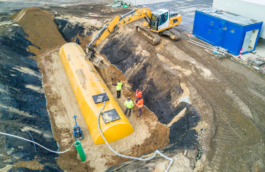 Three large underground oil storage tanks that are undergoing the closure process.